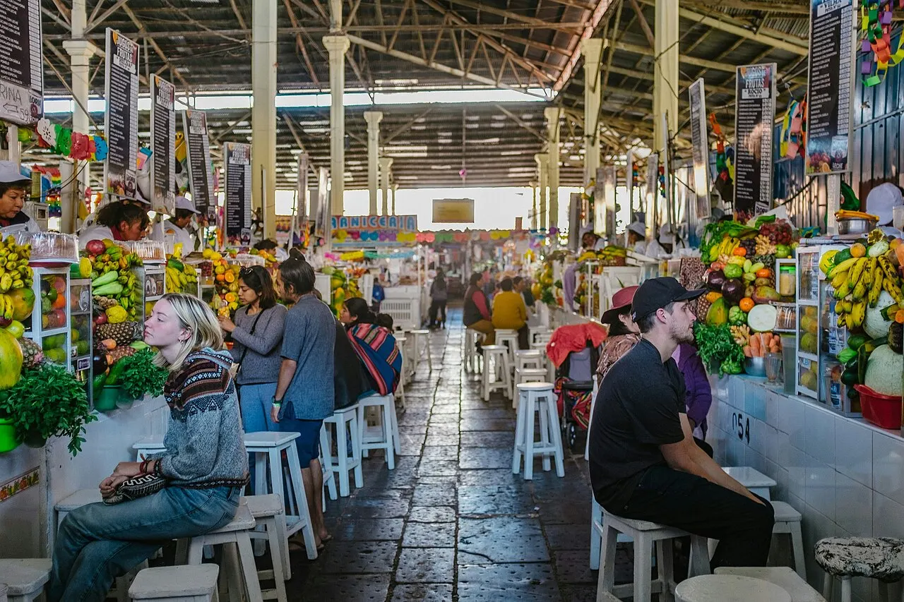 Stalls and shoppers inside the San Pedro market in Cusco, Peru