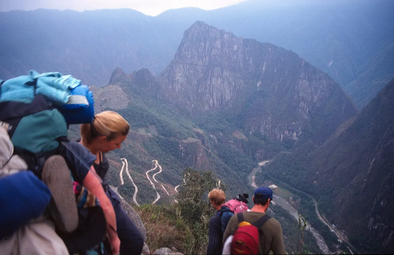 The Inca Trail stone path descending through cloud forest toward Machu Picchu from Inti Punku