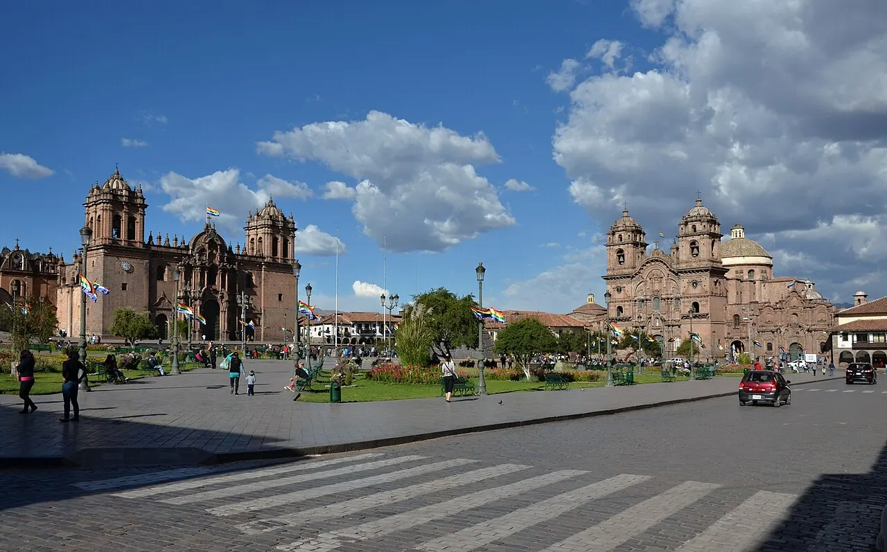 Cusco's Plaza de Armas with the cathedral and the Compania de Jesus church, Andean foothills behind