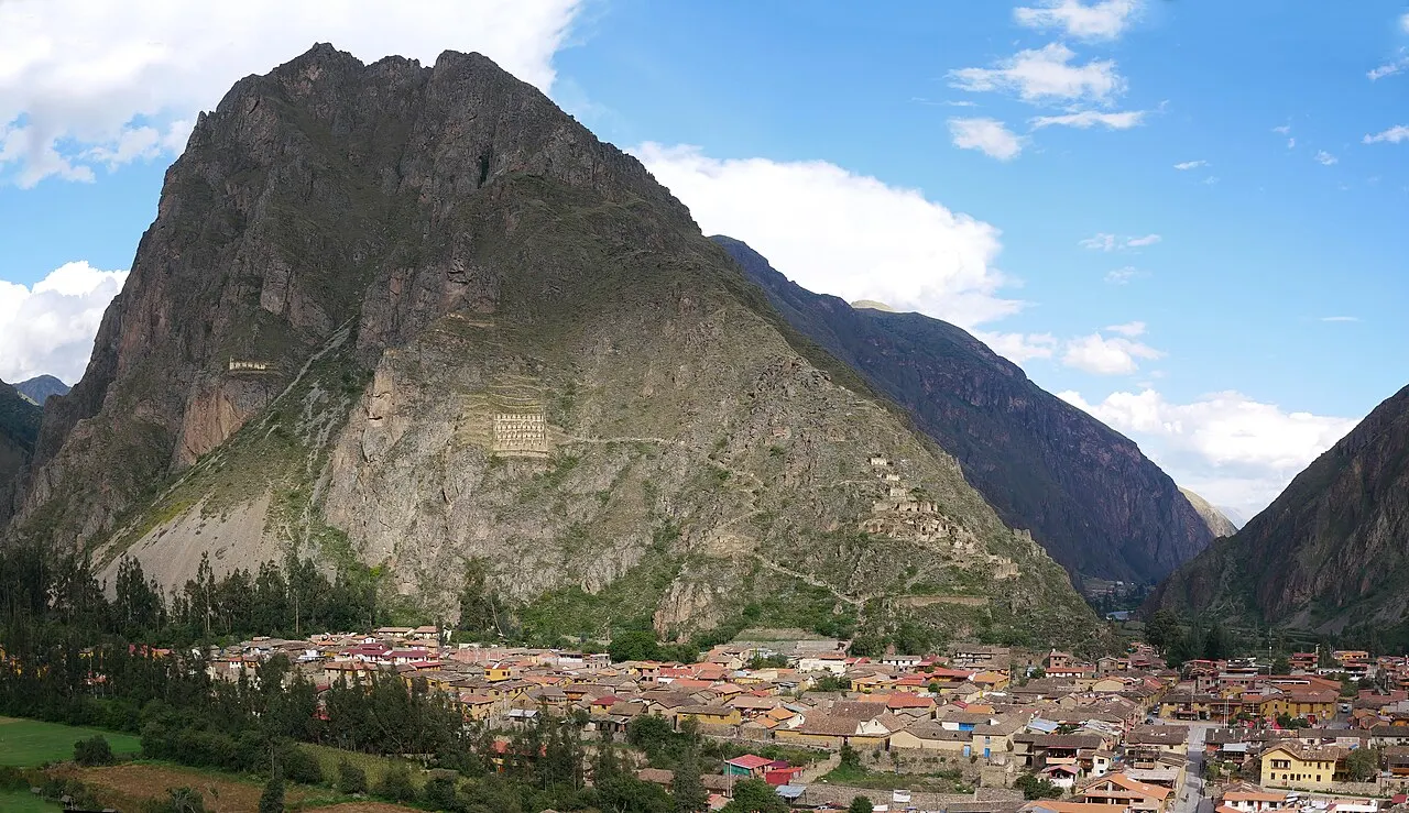 A view over the cobbled town of Ollantaytambo to the Inca ruins above its rooftops