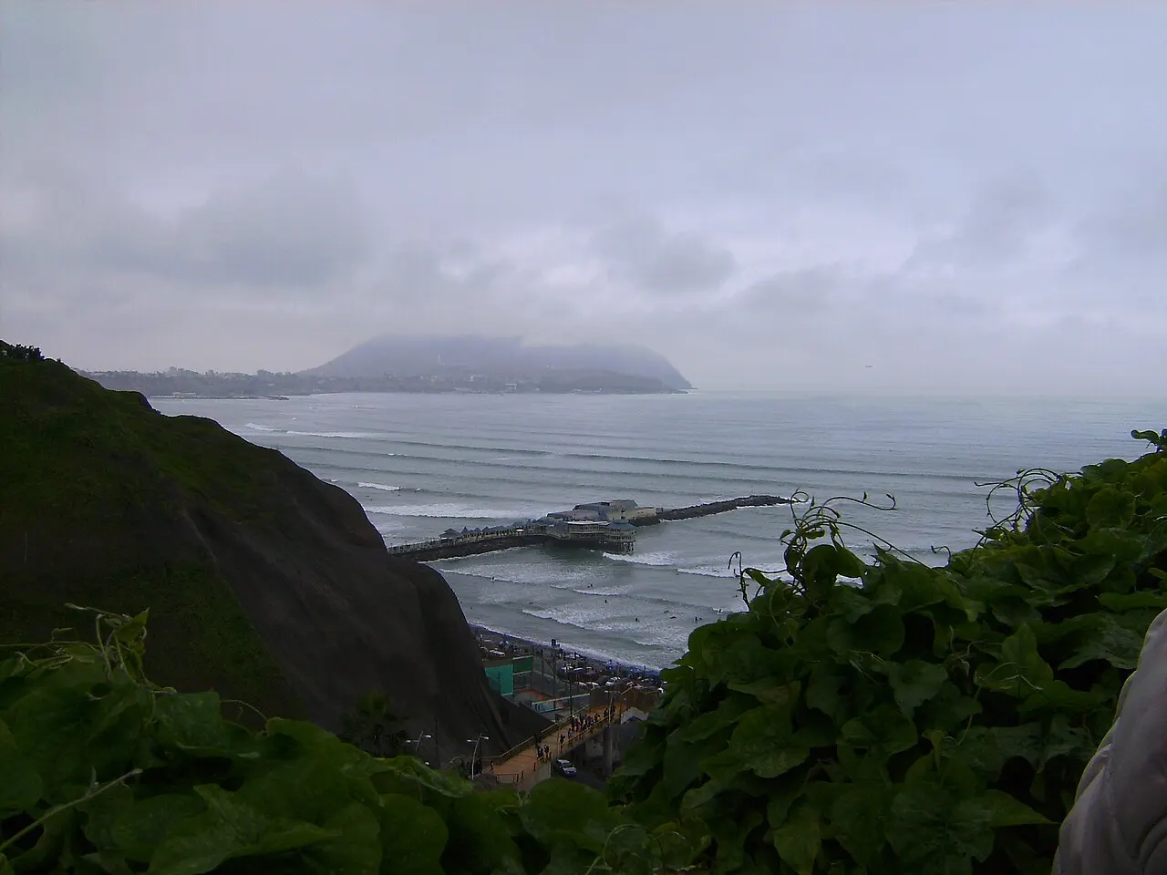The clifftop Malecon of Miraflores in Lima overlooking the Pacific surf and pier