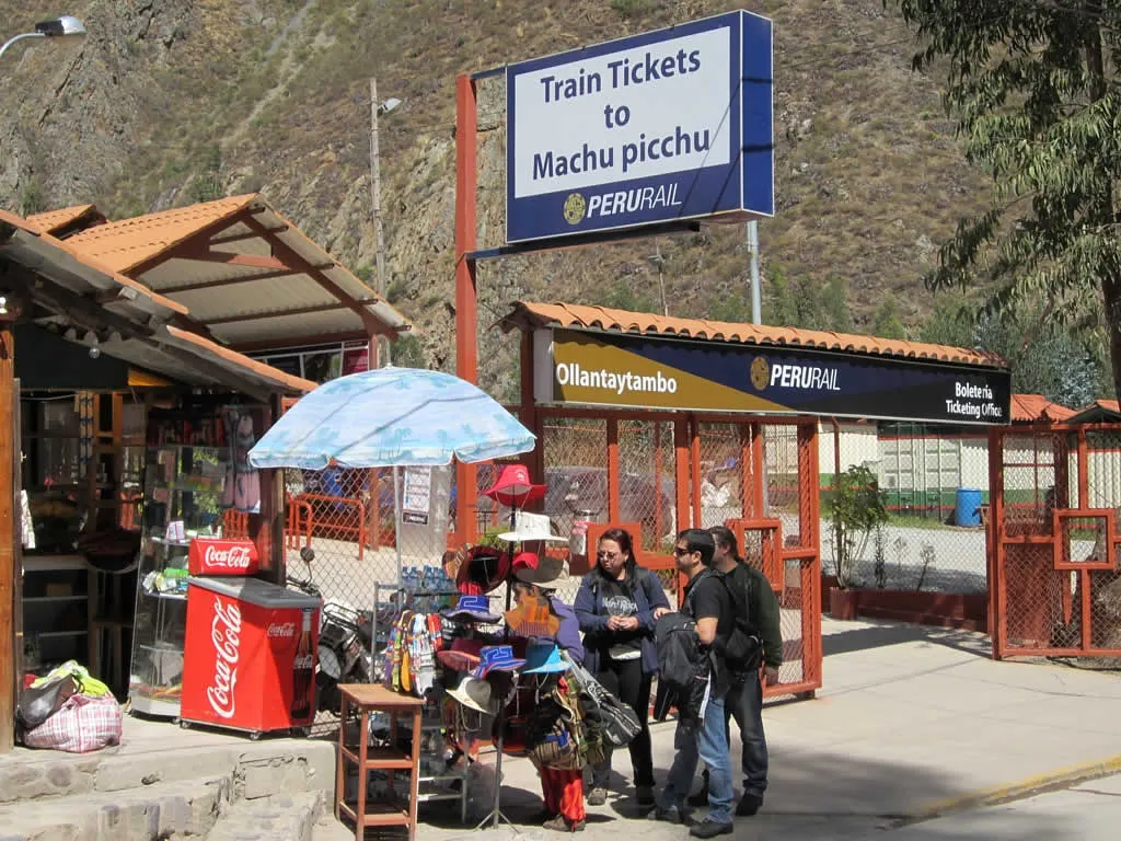 Travellers at the PeruRail Ollantaytambo station entrance in the Sacred Valley
