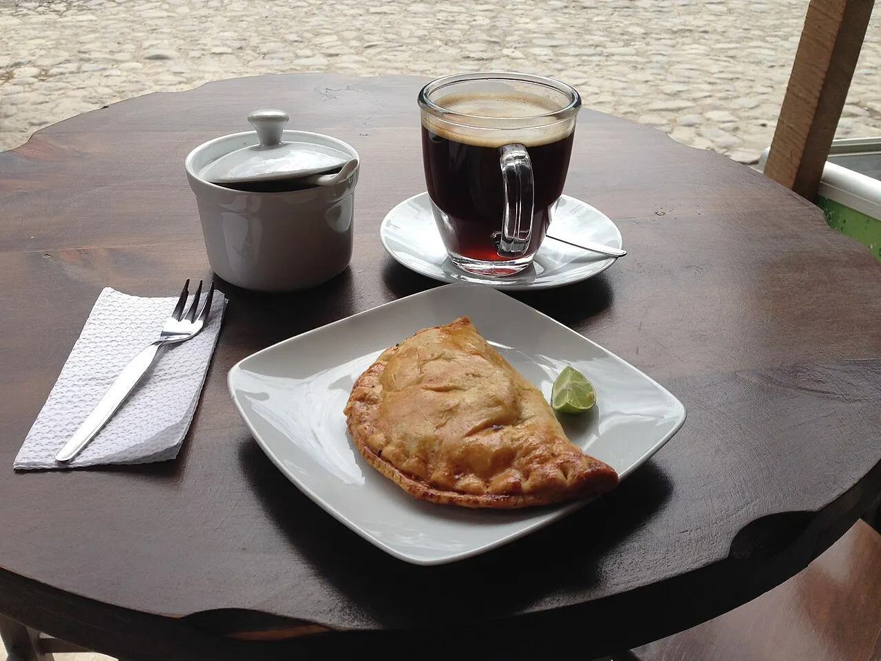 A plate of empanadas and a fresh meal at a restaurant in Ollantaytambo, Sacred Valley