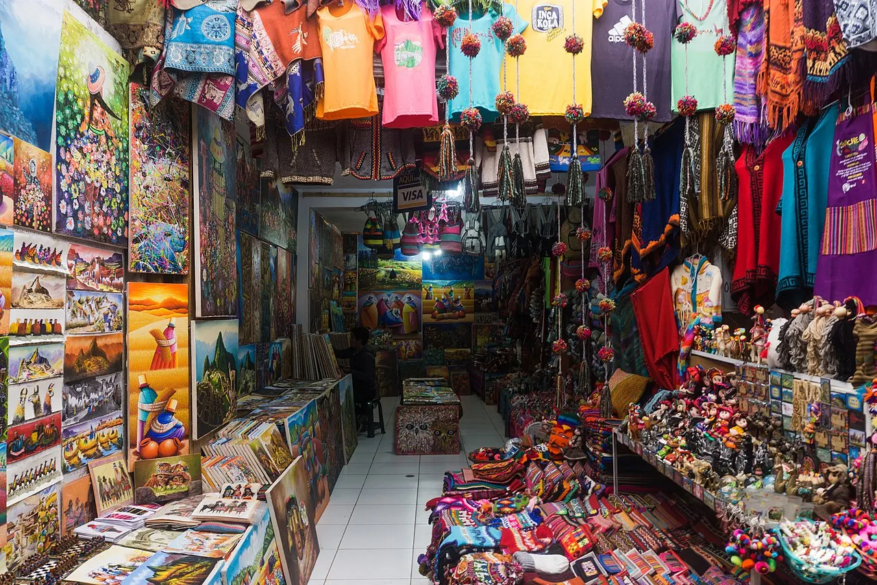Colourful stalls of the busy Pisac market in the Sacred Valley, Peru